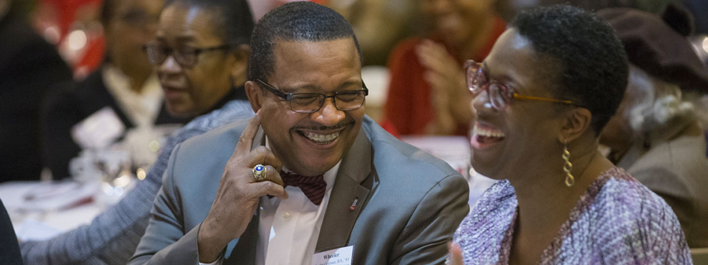 Meeting attendees smiling.